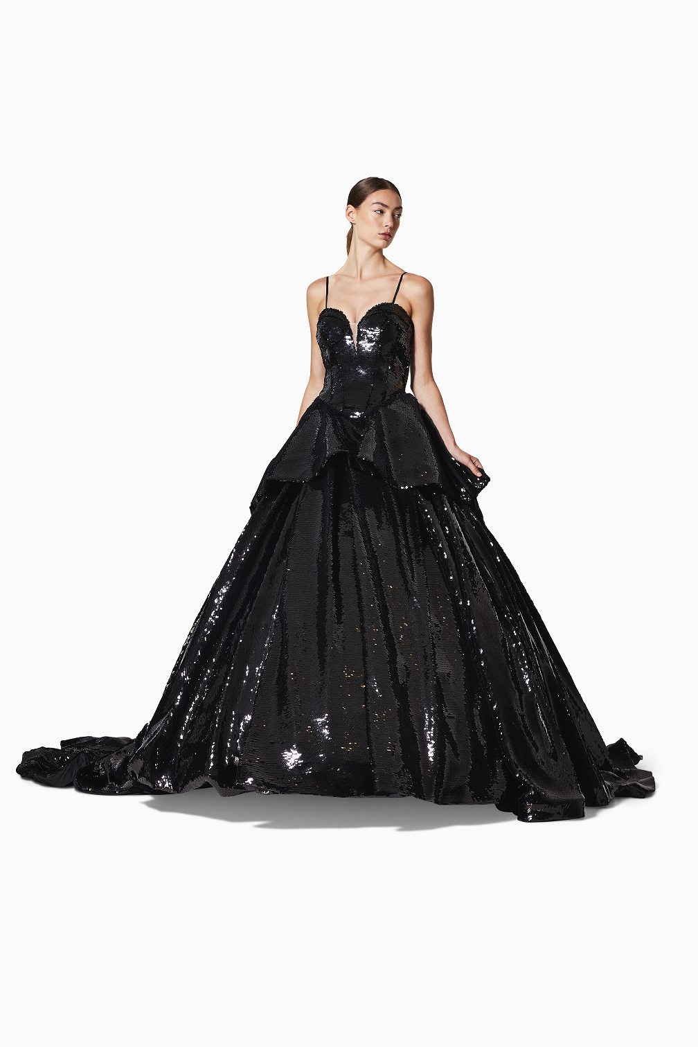 Black evening gown with sequin detailing on a white background