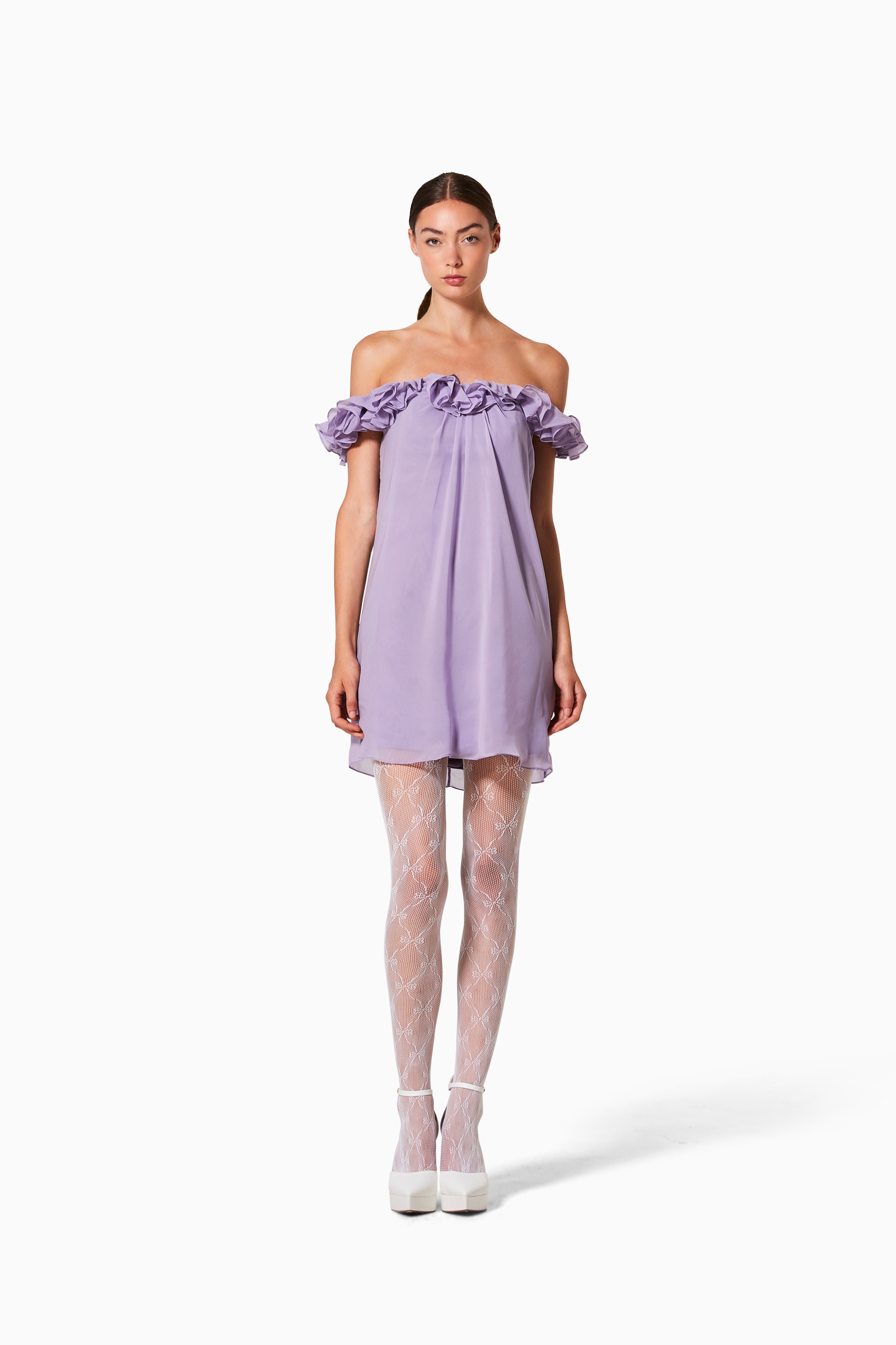 A model wearing a purple cocktail dress with chiffon underlay and a cotton stretch lining.