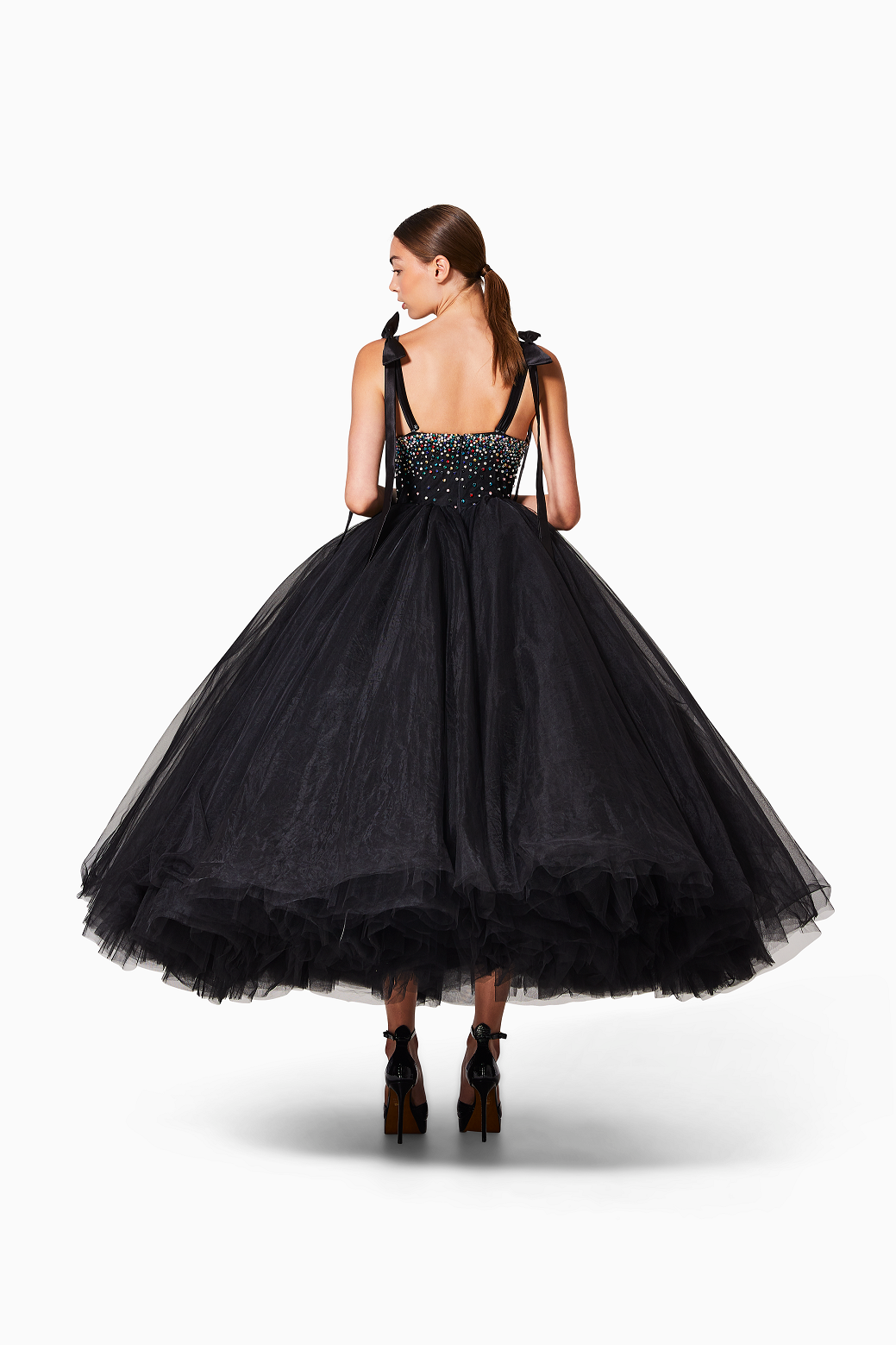 Black evening gown with beaded bodice on a white background